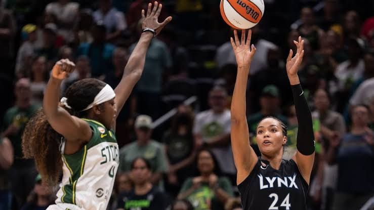 Napheesa Collier of the Minnesota Lynx shooting a basketball during a game against the Seattle Storm.