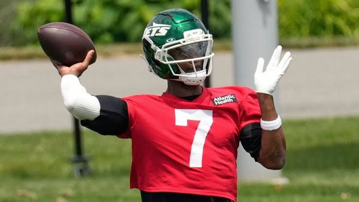 Geno Smith speaking to reporters at a press conference during New York Jets training camp in Florham Park, New Jersey.