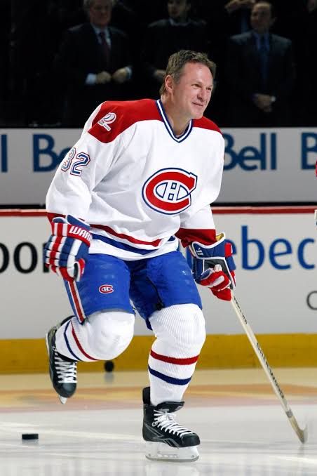 Claude Lemieux skates on the ice during the Montreal Canadiens centennial celebration in 2009.