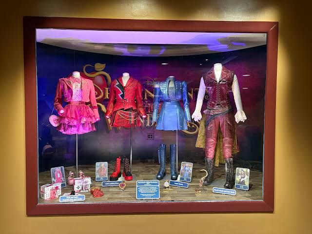 Costumes for the Queen of Hearts and Cinderella on display inside the Walt Disney Presents exhibit at Hollywood Studios.