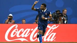 Kylian Mbappé running on the field during the 2026 FIFA World Cup third-place playoff match in Florida.