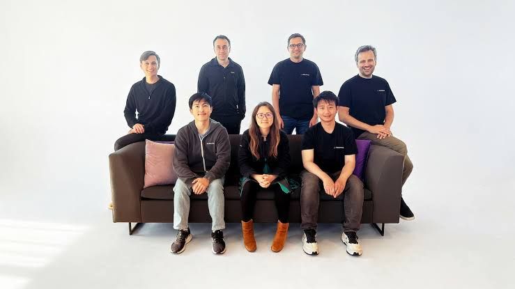 CEO Lin Qiao and the Fireworks team stand together at their company headquarters in San Mateo.