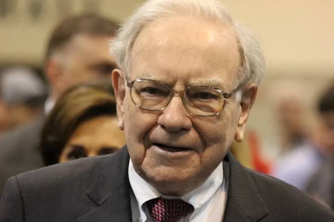 Warren Buffett looking forward during an interview about market trends and Berkshire Hathaway investments.