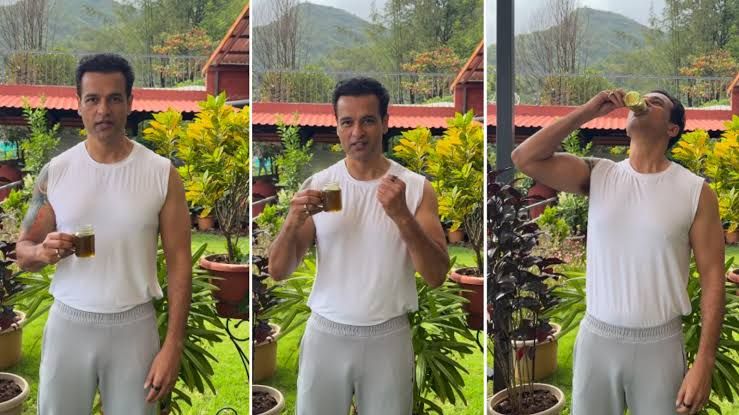 Rohit Roy preparing to consume a glass of medicated ghee as part of a supervised Panchakarma therapy session.