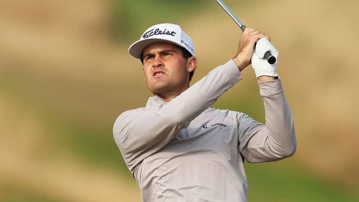Professional golfer Jackson Suber walking on the green during a competitive round at the 3M Open tournament.