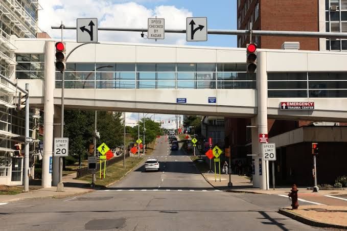 Upstate University Hospital medical staff assisting patients inside the crowded emergency department.