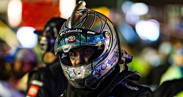 Bubba Wallace walks away from the NASCAR hauler after a meeting regarding a final-lap penalty at EchoPark Speedway.