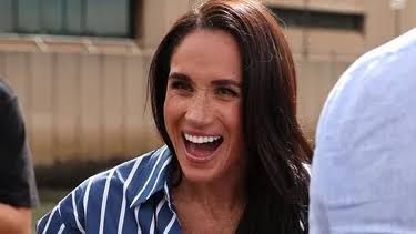 Meghan Markle jumping into a swimming pool holding balloons to celebrate her 45th birthday.