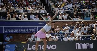 Lilli Tagger in a professional tennis pose on the court during the WTA Prague tournament.