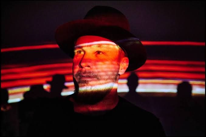 Jeff Ament sits for a portrait as Danny Clinch photographs him in Seattle, Washington.