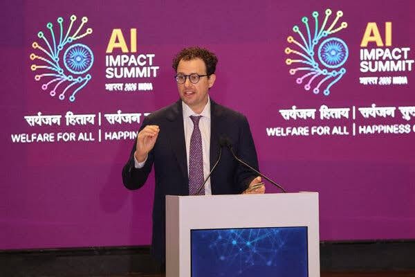 Dario Amodei speaking at a technology conference about AI safety standards and development roadmaps.