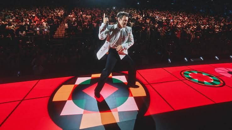 Harry Styles performs on a neon stage at Madison Square Garden during his 2026 residency.