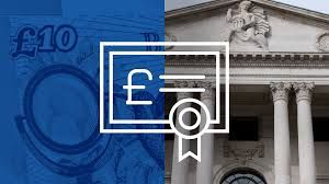 Andrew Bailey speaking at a podium regarding current Bank of England monetary policy decisions.