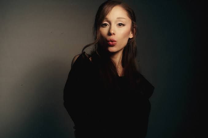 Ariana Grande posed for the promotional artwork of her latest musical release.
