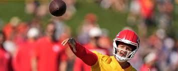 Patrick Mahomes during a Kansas City Chiefs game while looking toward the field.