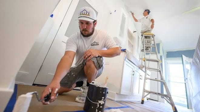 Nick Joe Kelley in a client's home, discussing the scaling of his Michigan-based renovation firm.