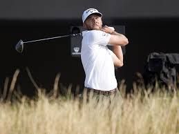 Cameron Young assessing his next shot from a bunker at the 18th hole during the final round of the 2026 Open Championship.