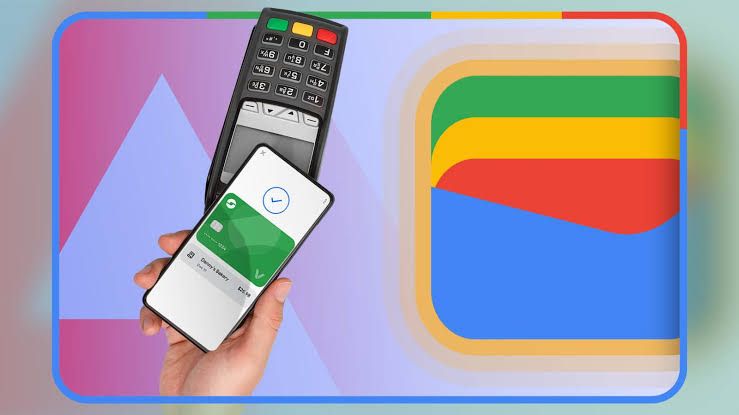 Smartphone with Google Wallet active at a payment terminal next to a physical loyalty card.