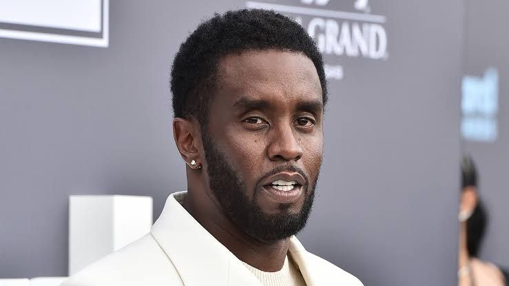 Sean Combs appears in a professional headshot used for court and federal prison documentation.