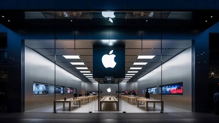A stylized graphic showing the Apple logo during an event announcement at Apple Park with text regarding the new CEO.
