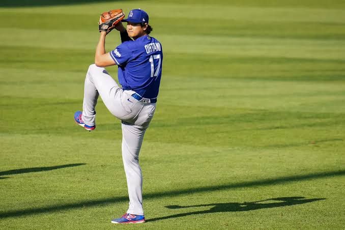 Shohei Ohtani standing on the mound at Citizens Bank Park wearing his Dodgers uniform.