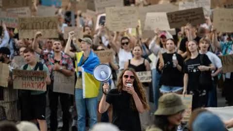 Protesters gather in Kyiv streets to demonstrate against the dismissal of Defense Minister Mykhailo Fedorov.
