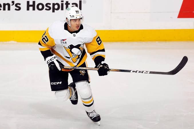 Pittsburgh Penguins defenseman Ryan Graves skating on the ice during an NHL game at PPG Paints Arena.