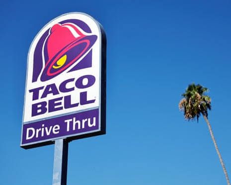 Taco Bell restaurant sign displayed outside a store location during a federal food safety investigation.
