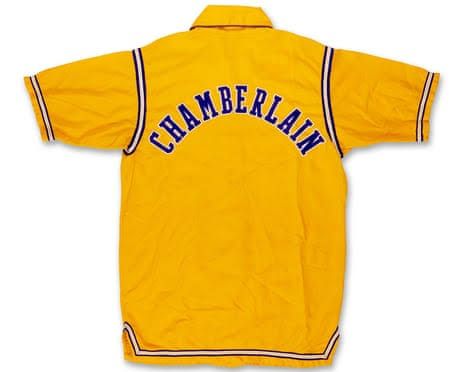A bright yellow warm-up jacket with the name Chamberlain on the back from the 1972 NBA Finals.
