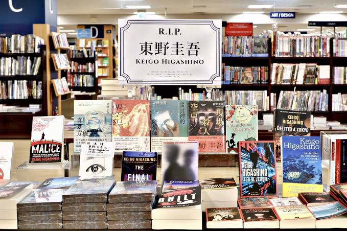 A book display featuring translations of Keigo Higashino's novels at Books Kinokuniya in Shinjuku, Tokyo.