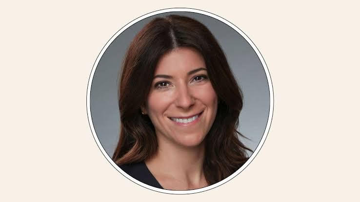Jenny Tartikoff smiling in a professional headshot against a neutral background.