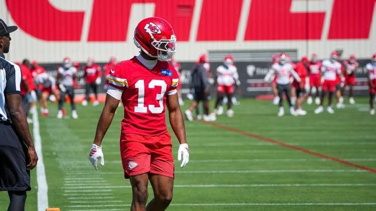Kansas City Chiefs rookie wide receiver Cyrus Allen grimacing on the field during a special teams training camp drill.