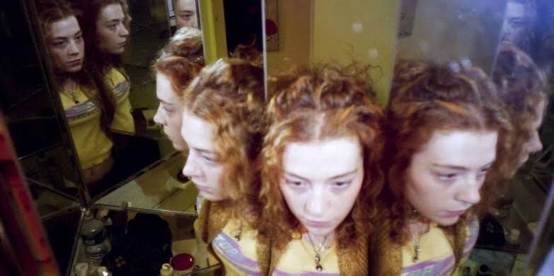 Melissa Auf der Maur posing in a house of mirrors in 1995 for her new project documentation.