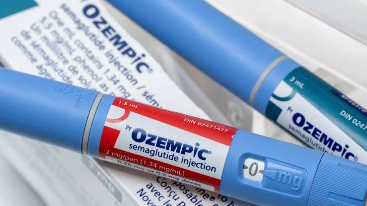 Close-up of a semaglutide injection pen on a table, representing research into its respiratory benefits.