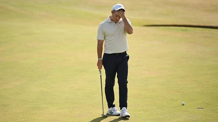 Rory McIlroy and Bryson DeChambeau at the 2026 Open Championship following a rules controversy and penalty.