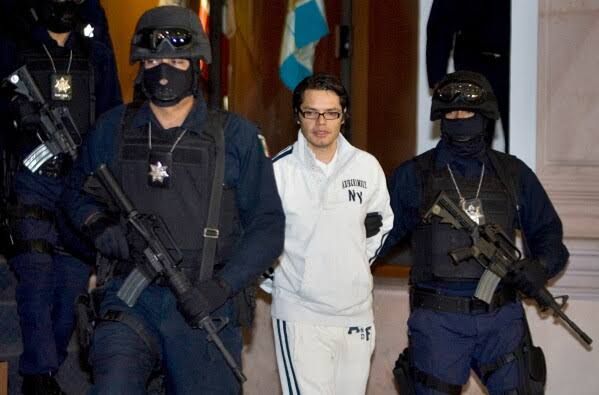Federal police in Mexico escorting Vicente Carrillo Leyva, a leader of the Juarez Cartel, during a 2009 presentation.