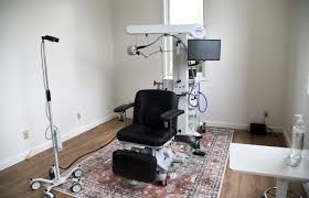 Medical staff demonstrate a TMS magnetic coil machine at the Humboldt Counseling Connection in Eureka.