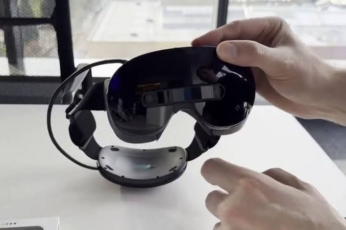 Close-up of the Steam Frame VR headset showing the new color passthrough camera module attached to the front casing.