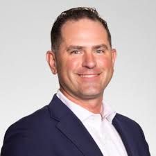 Kyle Stawicki, Managing Partner of Sax Wealth Advisors, speaking at a professional event.
