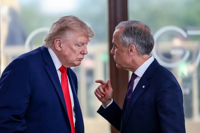 President Donald Trump and Canadian PM Mark Carney at a G7 summit work lunch in France.