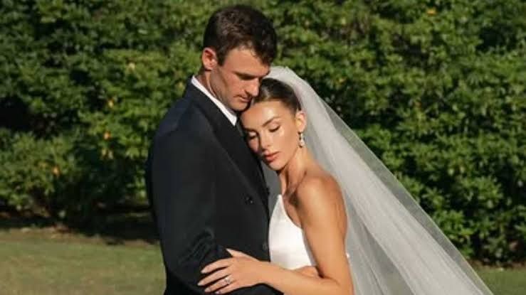 Tennis player Tommy Paul posing with Paige Lorenze during their engagement announcement.