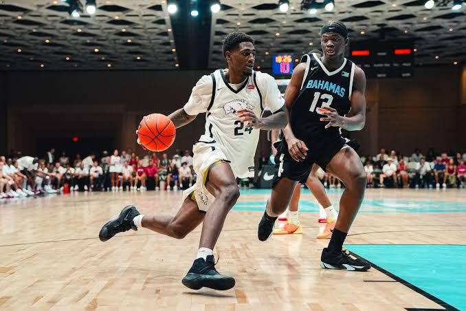 Billy Richmond III driving toward the basket during the Arkansas basketball game against the Bahamas Select team in Nassau.