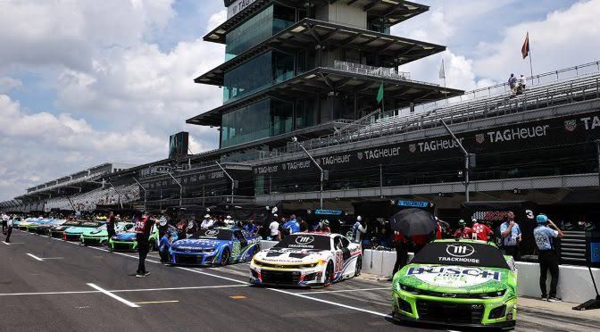 NASCAR race car on the Indianapolis Motor Speedway track during a practice session.