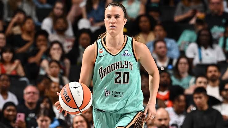 Sabrina Ionescu drives past defenders during the New York Liberty and Chicago Sky game at the arena.