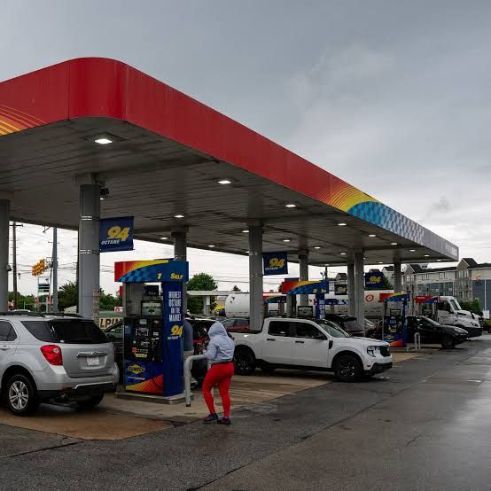 A person pumping gasoline at a Sunoco station in Philadelphia during May 2026.