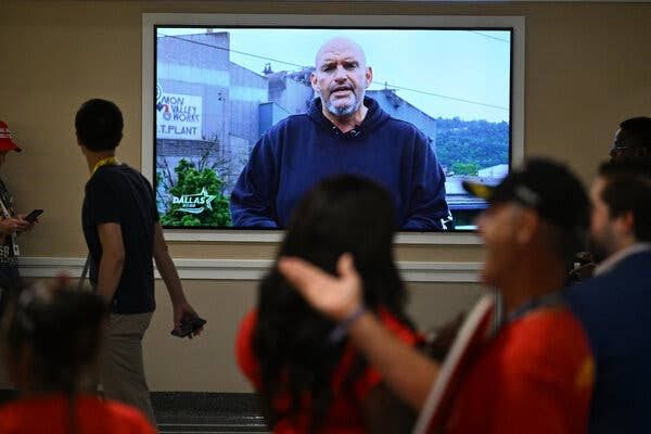 Senator John Fetterman speaks with delegates on the floor of the 2026 Republican National Convention.