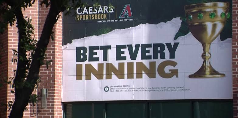 Fans watch a baseball game at Chase Field, where sports betting is a growing factor for attendees.