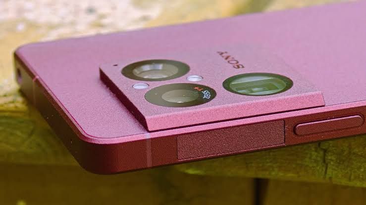 Sony Xperia 1 VIII smartphone held by a user, displaying camera interface settings on the screen.