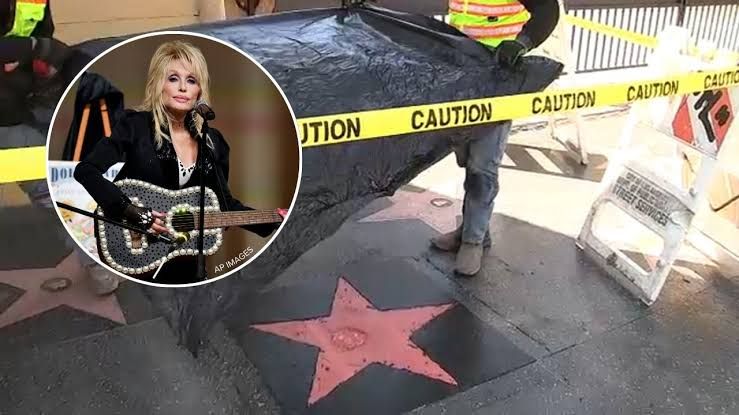 Dolly Parton's name engraved on a brass star on the Hollywood Walk of Fame.