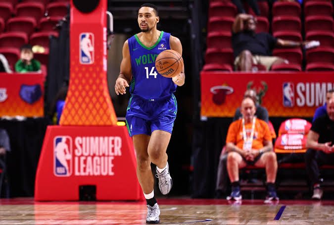 Trey Kaufman-Renn in a Timberwolves jersey handling the ball during a 2026 Summer League game in Las Vegas.